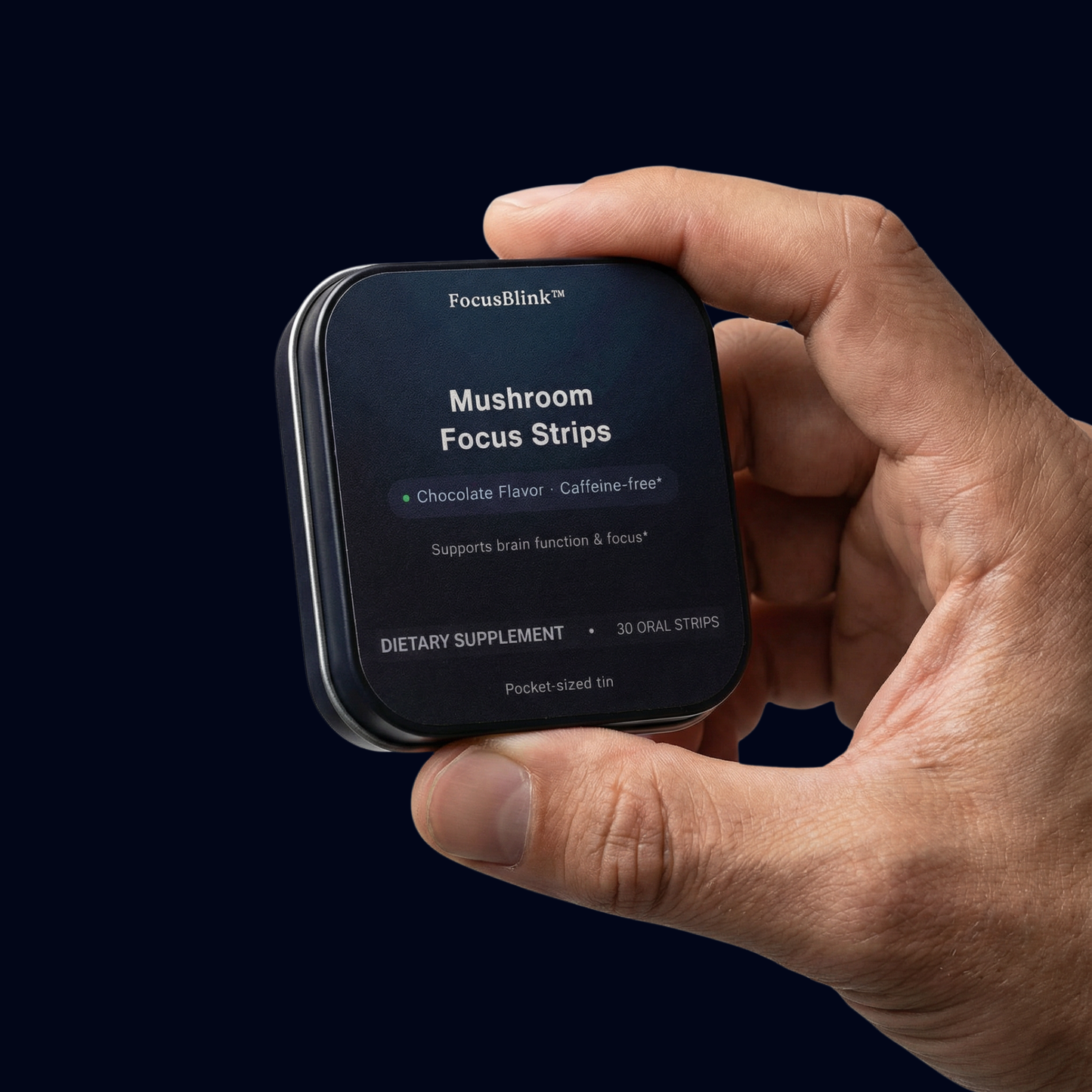 Hand holding a package of FocusBlink Mushroom Focus Strips against a dark background